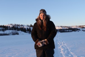 A picture of Katie Weaver standing on the frozen lake of Back Bay in Yellowknife,NWT.