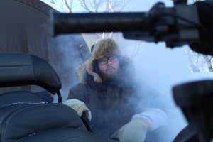 Vincent Weaver prepares his snowmobile for an afternoon ride in Yellowknife, NWT.